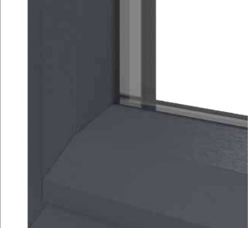 Corner of a Eurologik chamfered window frame in anthracite grey